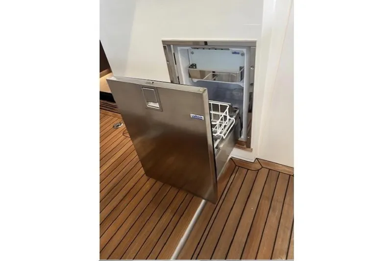  Yacht Photos Pics Stainless steel drawer on 2022 Sealine C335V yacht, open on wooden deck.