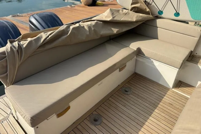  Yacht Photos Pics 2022 Sealine C335V boat interior with beige seating and wooden deck.