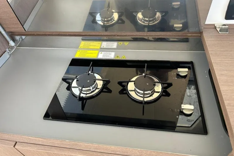  Yacht Photos Pics Modern gas stove in 2022 Sealine C335V yacht kitchen.