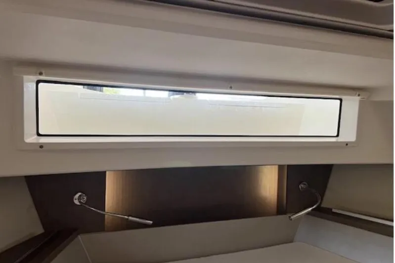  Yacht Photos Pics Interior view of 2022 Sealine C335V yacht window and lighting fixtures.