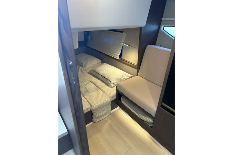  Yacht Photos Pics 2022 Sealine C335V cabin interior with bed and seating area.