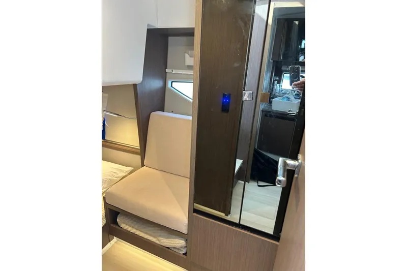  Yacht Photos Pics 2022 Sealine C335V interior with seating and modern design elements.