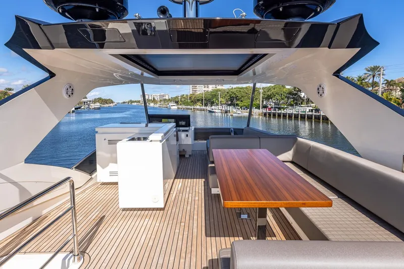  Yacht Photos Pics Luxurious 2024 Astondoa 66 Flybridge yacht with spacious deck and elegant seating area.