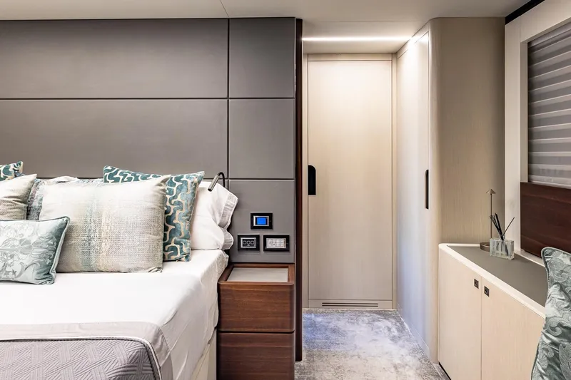  Yacht Photos Pics Luxurious bedroom interior of 2024 Astondoa 66 Flybridge yacht with elegant decor and modern design.