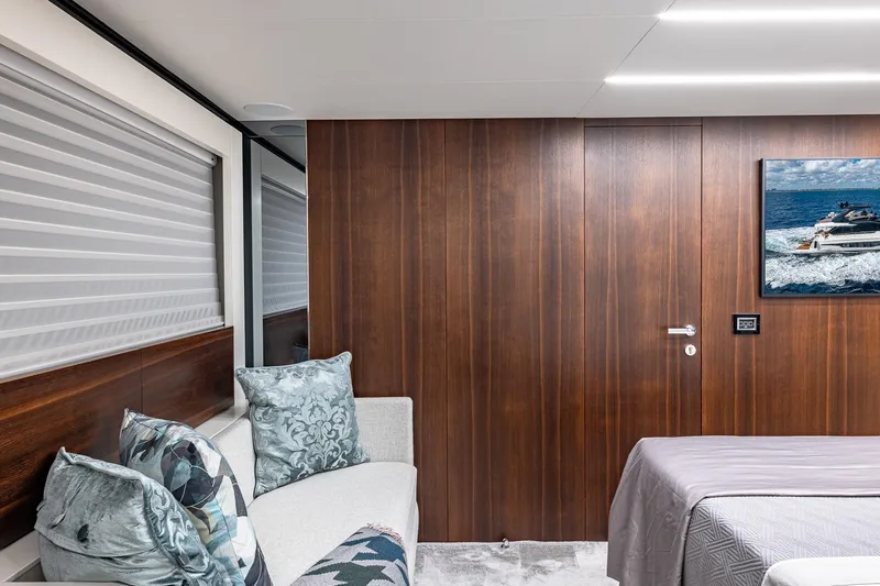  Yacht Photos Pics Luxurious interior of 2024 Astondoa 66 Flybridge yacht with elegant wood paneling and plush seating.