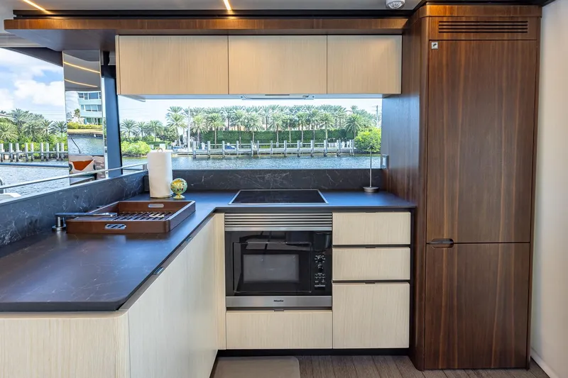  Yacht Photos Pics Luxurious kitchen interior of 2024 Astondoa 66 Flybridge yacht with modern appliances and scenic view.