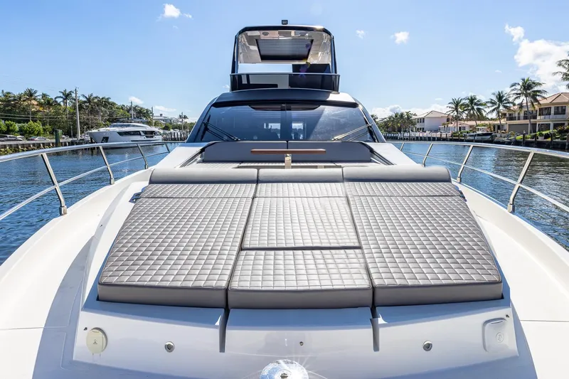  Yacht Photos Pics 2024 Astondoa 66 Flybridge yacht with luxurious sunbathing area on deck.