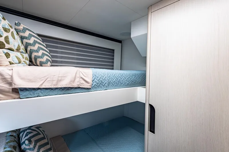  Yacht Photos Pics Luxurious bunk beds in the 2024 Astondoa 66 Flybridge yacht cabin.