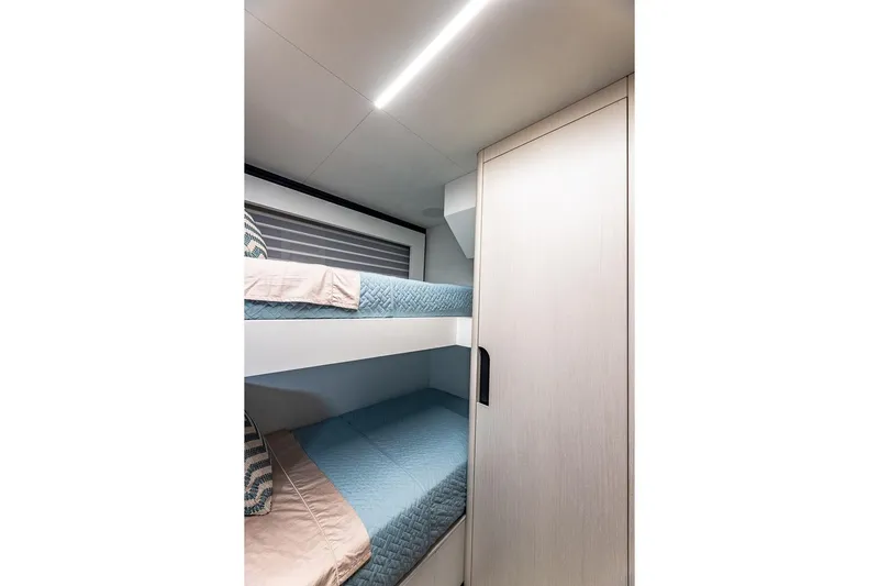  Yacht Photos Pics 2024 Astondoa 66 Flybridge interior with bunk beds and modern design.
