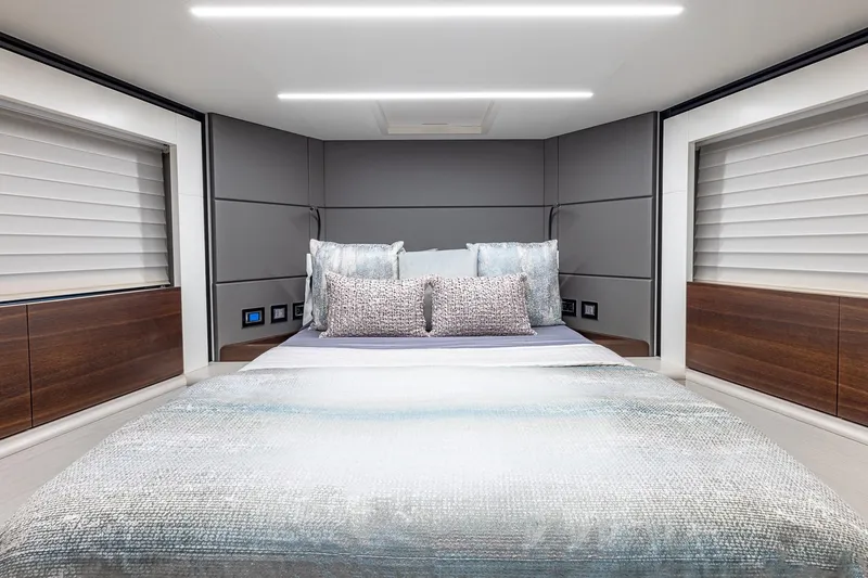  Yacht Photos Pics Luxurious bedroom interior of 2024 Astondoa 66 Flybridge yacht with modern design.