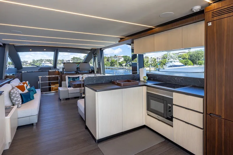  Yacht Photos Pics Luxurious interior of 2024 Astondoa 66 Flybridge yacht with modern kitchen and seating area.