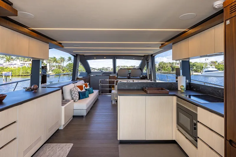  Yacht Photos Pics Luxurious interior of 2024 Astondoa 66 Flybridge yacht with modern kitchen and scenic views.