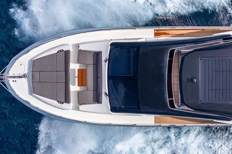  Yacht Photos Pics 2024 Astondoa 66 Flybridge yacht cruising on ocean, aerial view.