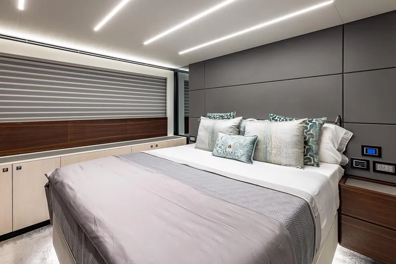  Yacht Photos Pics Luxurious bedroom interior of 2024 Astondoa 66 Flybridge yacht, featuring modern design and elegant decor.