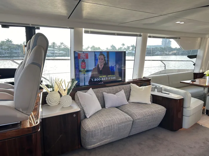 Fairline Squadron Yacht Photos Pics Luxurious interior of 2024 Fairline Squadron 68 yacht with modern seating and TV.