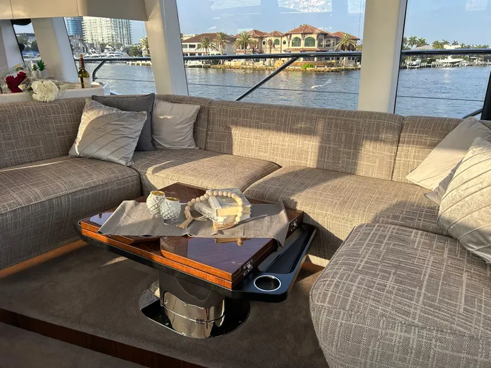 Fairline Squadron Yacht Photos Pics Luxurious interior of 2024 Fairline Squadron 68 yacht with elegant seating and waterfront view.