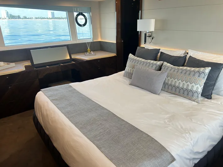 Fairline Squadron Yacht Photos Pics Luxurious bedroom interior of 2024 Fairline Squadron 68 yacht with ocean view.