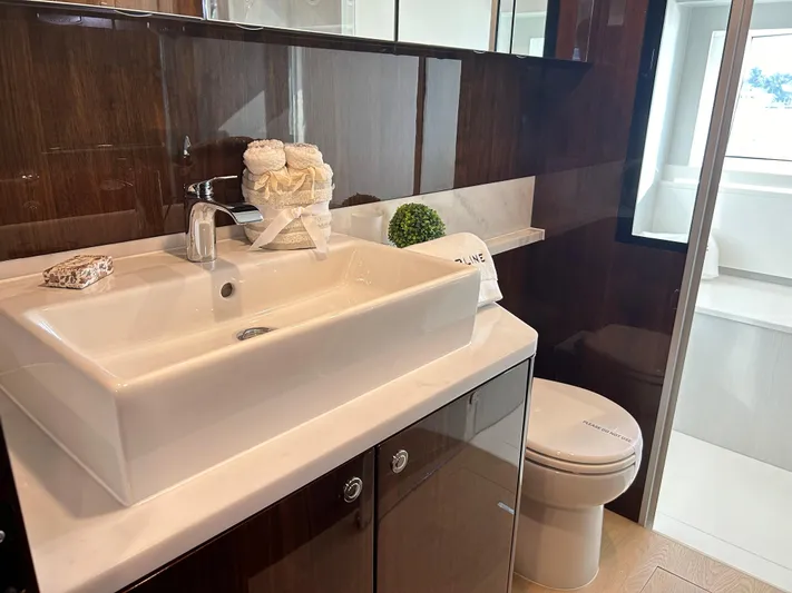 Fairline Squadron Yacht Photos Pics Luxurious bathroom in 2024 Fairline Squadron 68 yacht with modern sink and toilet.