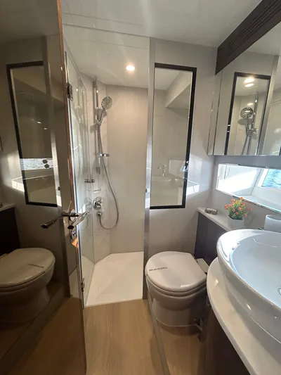 Fairline Squadron Yacht Photos Pics Luxurious bathroom in 2024 Fairline Squadron 68 yacht with modern fixtures and elegant design.