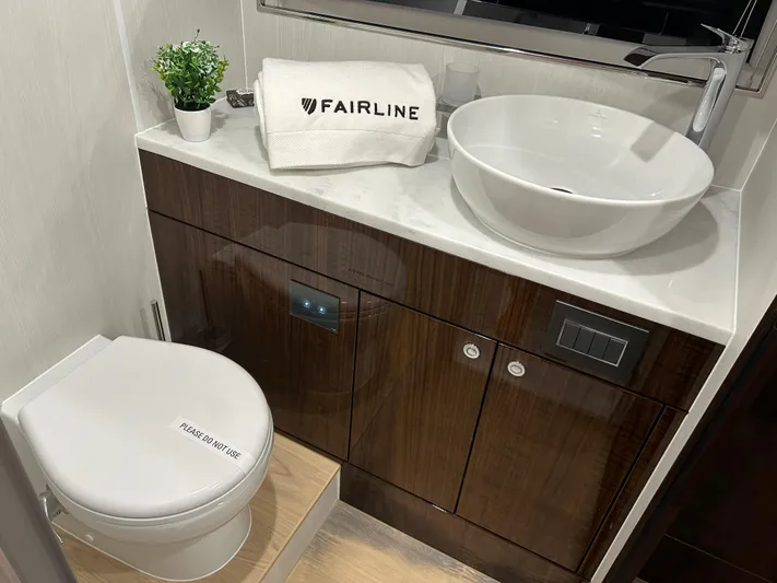 Fairline Squadron Yacht Photos Pics Luxury bathroom in 2024 Fairline Squadron 68 yacht with modern sink and toilet.