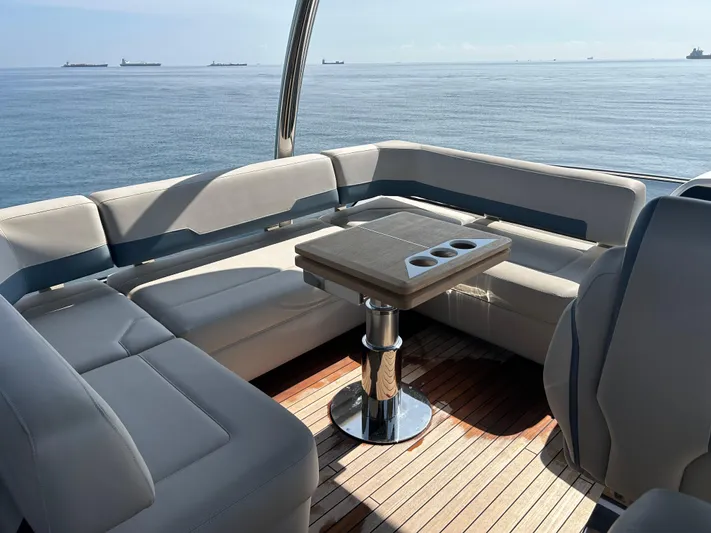 Fairline Squadron Yacht Photos Pics Luxurious seating area on 2024 Fairline Squadron 68 yacht with ocean view.