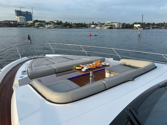 Fairline Squadron Yacht Photos Pics Luxurious 2024 Fairline Squadron 68 yacht with elegant deck seating and waterfront view.