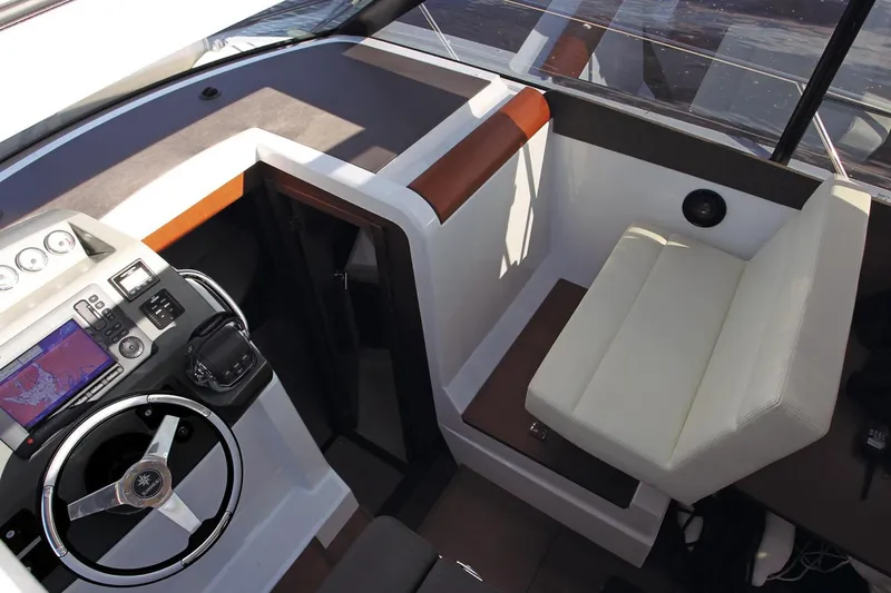  Yacht Photos Pics Manufacturer Provided Image: 2018 Jeanneau NC 9 boat cockpit with steering wheel and navigation system.