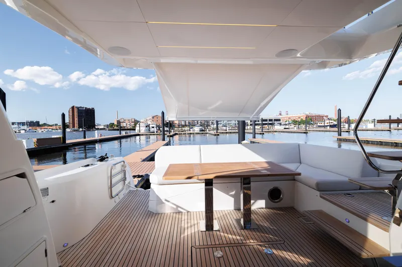  Yacht Photos Pics 2024 Prestige 520 yacht with spacious deck and waterfront view.