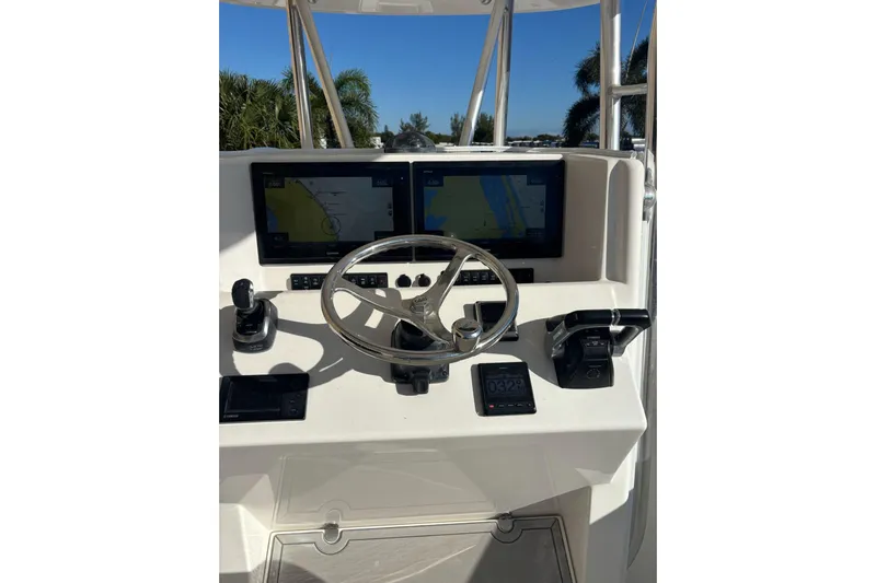  Yacht Photos Pics 2017 Venture 39 Open boat helm with dual navigation screens and steering wheel.