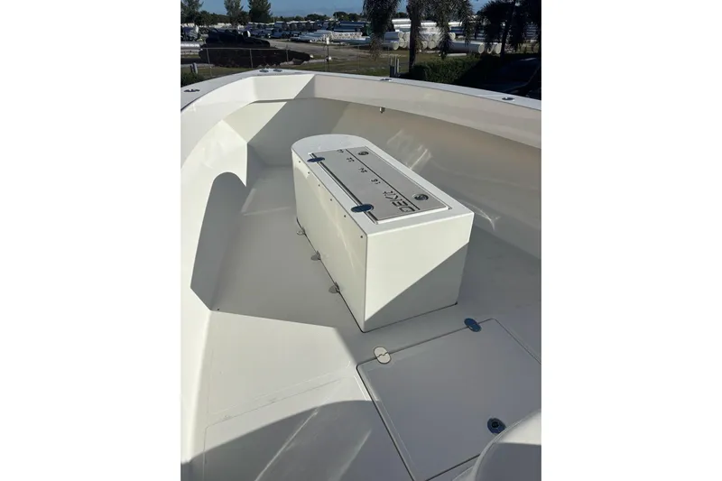  Yacht Photos Pics 2017 Venture 39 Open boat deck with storage compartment, outdoor setting.