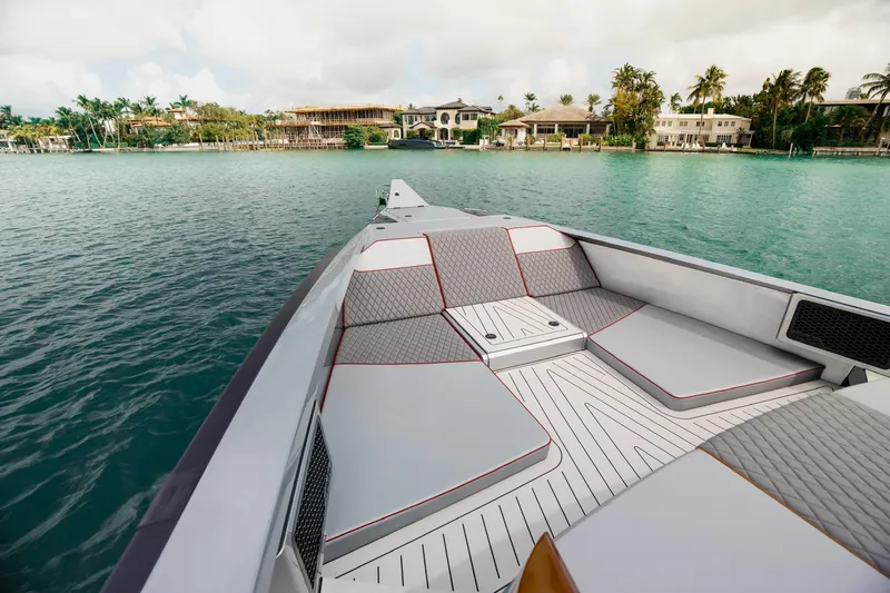 Mana Yacht Photos Pics Luxury Maori 54XL yacht deck, 2025 model, with elegant seating and scenic waterfront view.