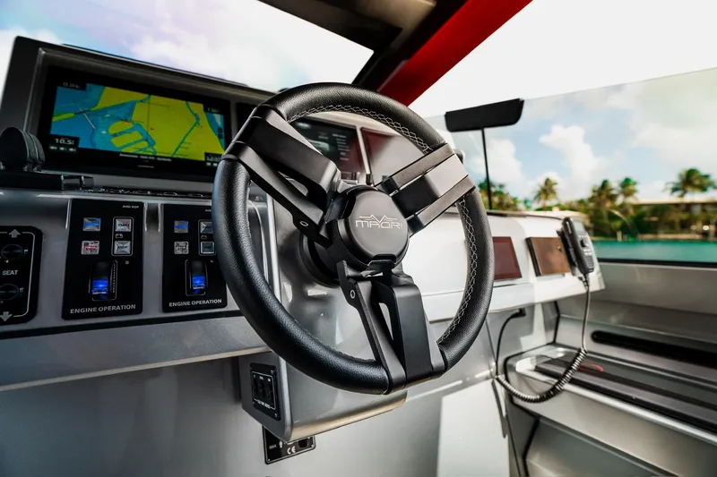Mana Yacht Photos Pics Steering wheel of 2025 Maori 54XL yacht with navigation controls and display.