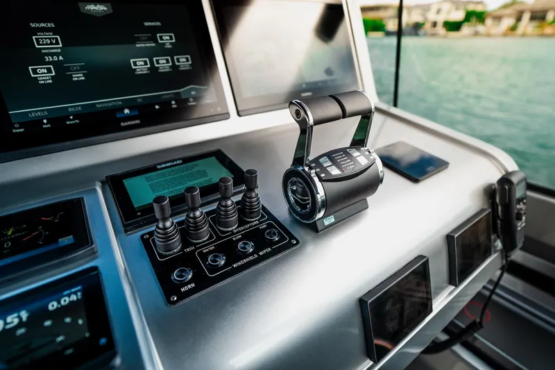 Mana Yacht Photos Pics Control panel of a 2025 Maori 54XL yacht with advanced navigation systems.