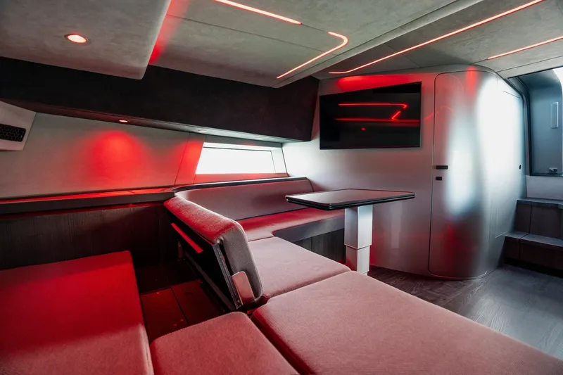 Mana Yacht Photos Pics Modern interior of 2025 Maori 54XL yacht with sleek design and ambient red lighting.