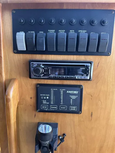 Blue Goose Yacht Photos Pics Control panel of 2003 Sabre 36 Fly Bridge Sedan with switches and audio system.