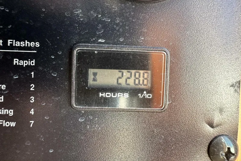 Blue Goose Yacht Photos Pics Hour meter reading 228.8 on 2003 Sabre 36 Fly Bridge Sedan dashboard.