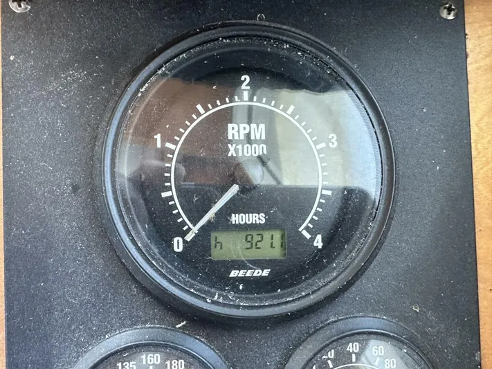Blue Goose Yacht Photos Pics RPM gauge showing 921 hours on a 2003 Sabre 36 Fly Bridge Sedan.