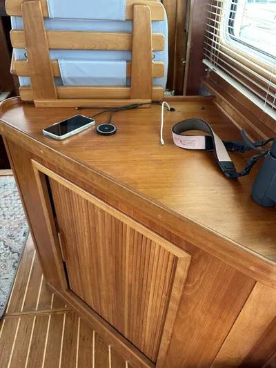 Blue Goose Yacht Photos Pics 2003 Sabre 36 Fly Bridge Sedan interior with wooden cabinet and accessories.