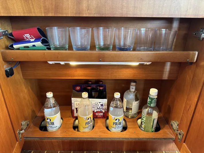 Blue Goose Yacht Photos Pics Cabinet with glasses and beverages on a 2003 Sabre 36 Fly Bridge Sedan.