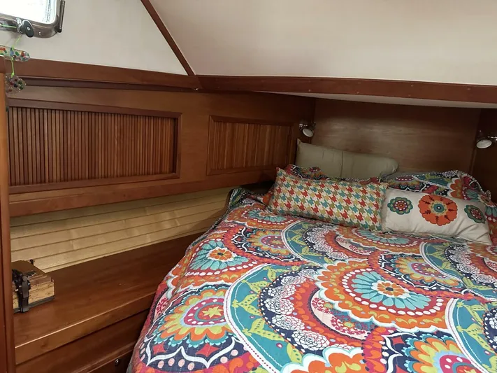 Blue Goose Yacht Photos Pics Cozy cabin interior of 2003 Sabre 36 Fly Bridge Sedan with colorful bedding.