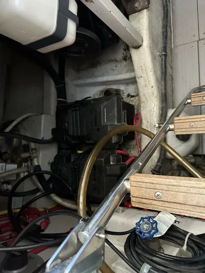 Blue Goose Yacht Photos Pics Engine compartment of a 2003 Sabre 36 Fly Bridge Sedan with visible components and wiring.