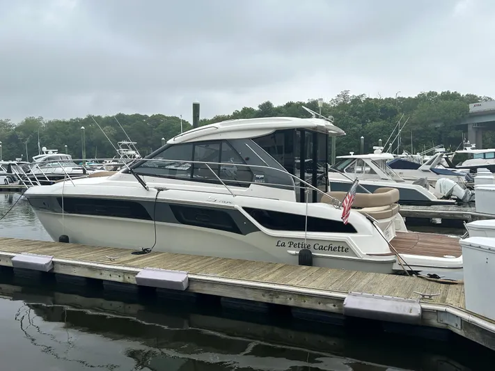  Yacht Photos Pics 2017 Bavaria S36 Coupe docked at a marina on a cloudy day.