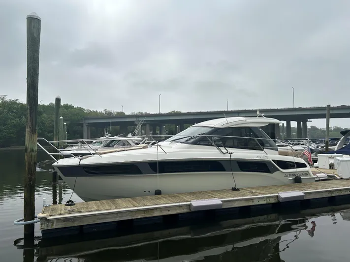  Yacht Photos Pics 2017 Bavaria S36 Coupe docked at a marina under cloudy skies.
