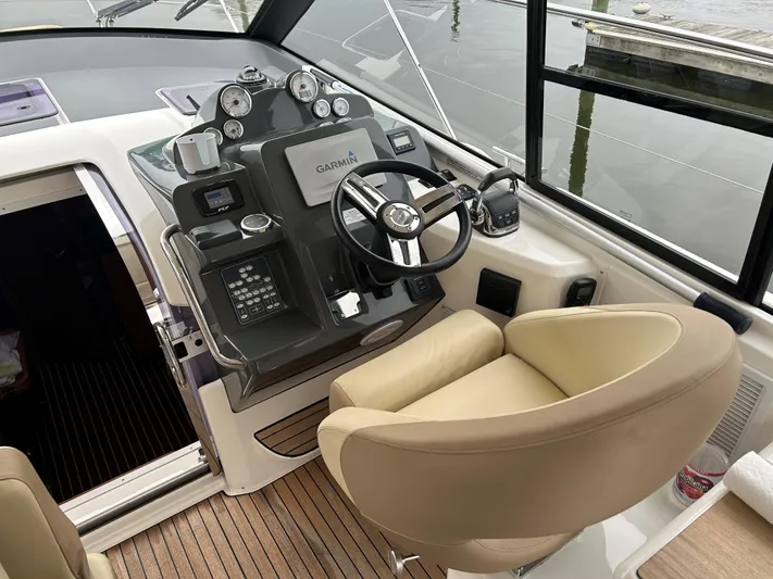  Yacht Photos Pics Helm of 2017 Bavaria S36 Coupe with modern controls and beige seating.