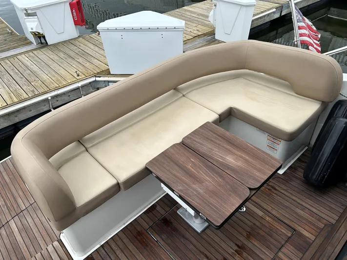  Yacht Photos Pics Luxurious seating area on a 2017 Bavaria S36 Coupe yacht with wooden table.