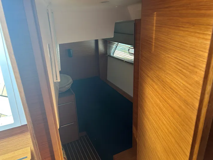  Yacht Photos Pics Interior cabin of 2017 Bavaria S36 Coupe with wooden finish and window blinds.