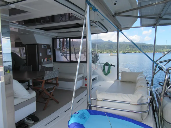 Lady Ana Yacht Photos Pics Luxurious Bali 4.1 catamaran interior with seating, table, and scenic ocean view, 2020 model.