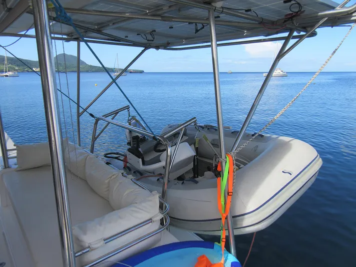 Lady Ana Yacht Photos Pics Catamaran Bali 4.1 with dinghy on calm sea, 2020 model.