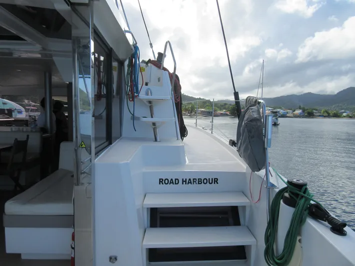 Lady Ana Yacht Photos Pics Bali 4.1 catamaran docked at Road Harbour, 2020 model, with scenic coastal view.