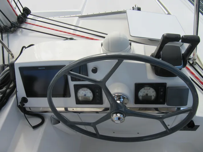 Lady Ana Yacht Photos Pics Steering wheel and controls of a 2020 Bali 4.1 yacht cockpit.